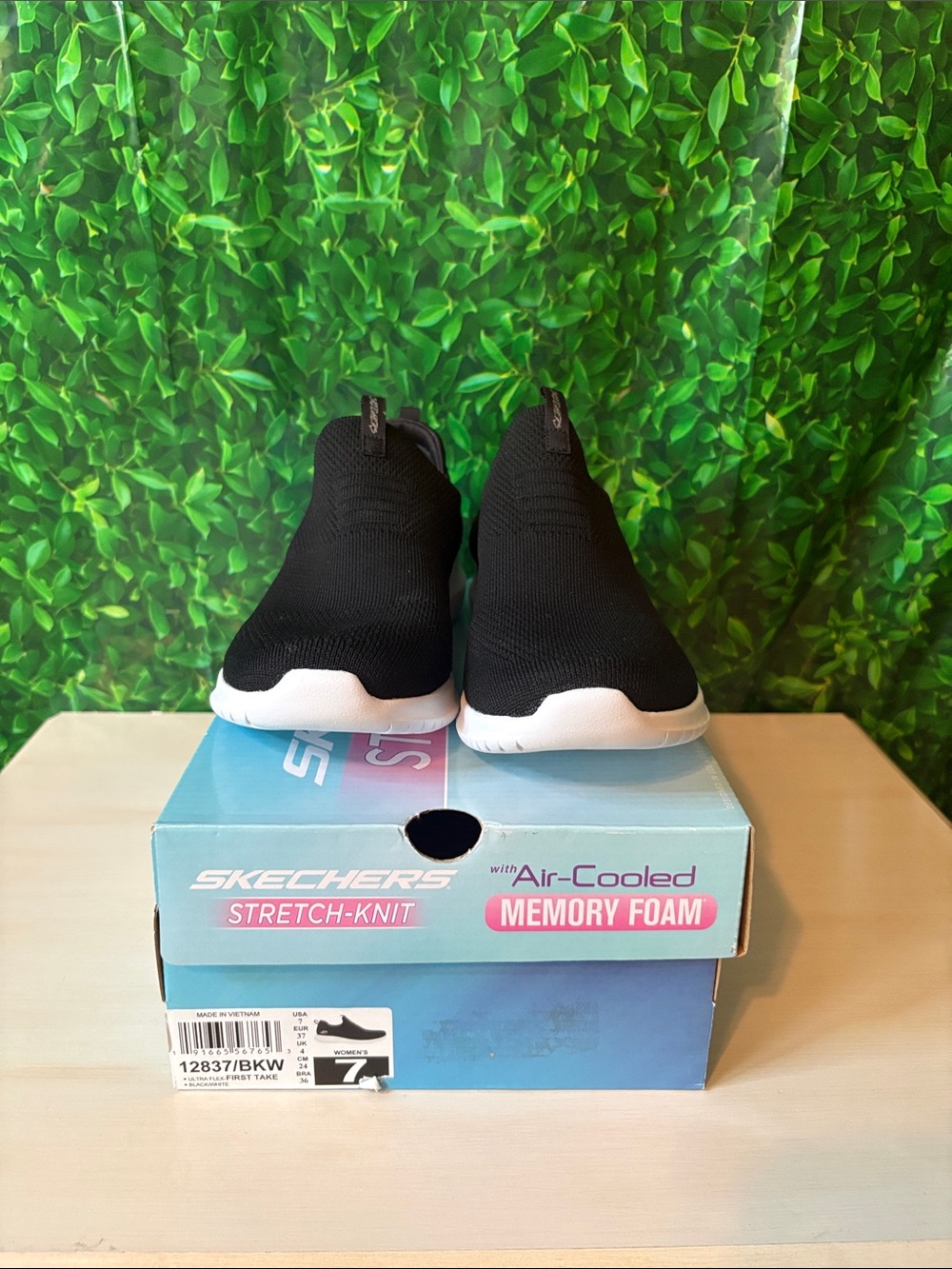 Skechers Women’s Black Slip-On Knit Sneakers with White Sole
